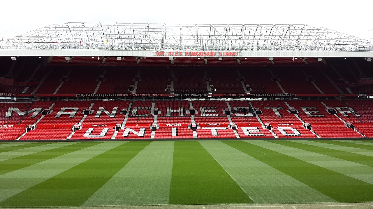 Man United vs Liverpool Preview: All You Need To Know About the Big Match Sir Alex Ferguson Stand at Old Trafford stadium in Manchester, showing the iconic main stand of Manchester United F.C. with fans seating and stadium architecture