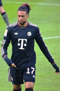 Michael Olise in action during a Bayern Munich match against RB Salzburg in a friendly game